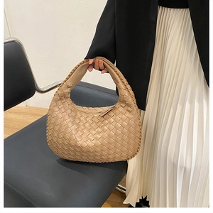 Detailed close-up of woven PU leather hobo bag texture in khaki brown finish