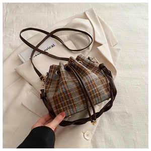 Chic tweed bucket bag with retro blue brown plaid pattern and drawstring closure