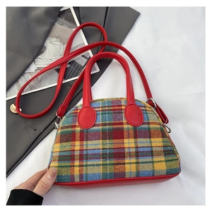 Chic 2024 plaid fabric handbag with red leather handles and adjustable shoulder strap