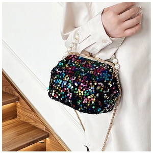 Detail of colorful sequined evening shell bag with pearl handle and golden chain