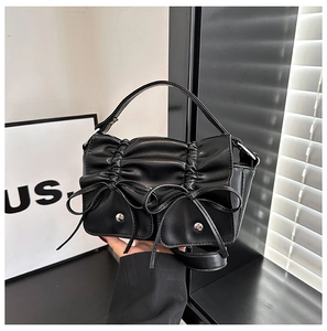 2024 trendy black ruched handbag with decorative bows and silver hardware accents