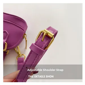 Detail of adjustable purple PU leather shoulder strap with vintage gold buckle