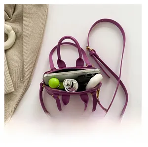 Top view of purple PU leather bag interior showing space for phone and makeup