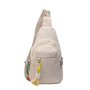 Minimalist cream nylon crossbody bag with floral jacquard strap and outdoor rope detail