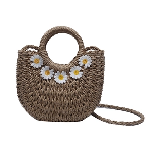 Handwoven khaki straw handbag with white daisy embroidery and round integrated handle