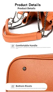 Détail de la poignée ergonomique en cuir orange et des clous de protection en métal