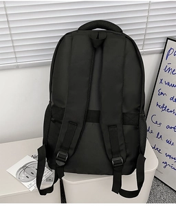 Rear view of black nylon backpack featuring breathable S-straps and luggage trolley sleeve