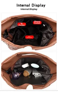 Internal view of brown leather handbag showing spacious compartments and pockets for storage