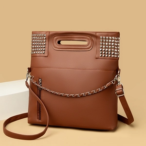 Brown textured faux leather tote bag with silver studs and decorative chain detail