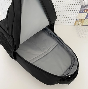 Detail showing the spacious main compartment with light gray lining and side mesh pocket