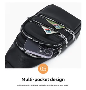 Detail showing high-capacity triple zipper compartments of black lychee grain leather bag