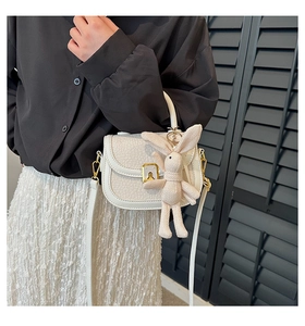 White faux crocodile leather mini shoulder bag featuring a cute bunny charm attachment