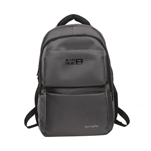 Minimalist dark grey nylon backpack with wide mesh straps and front zipper pocket