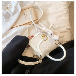 Minimalist white faux crocodile skin handbag with golden lock and rabbit charm decoration
