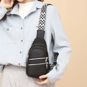 Chic black faux leather crossbody bag for women with dual zipper and geometric strap