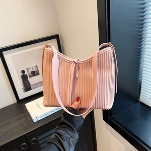Pale pink pleated tote bag with vertical stripes and adjustable shoulder strap for women