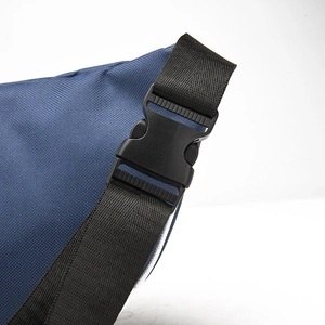 Detailed macro view of high-quality black side-release buckle and nylon strap on a blue bag