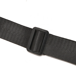 Detail of adjustable black nylon shoulder strap with plastic buckle for chest bag