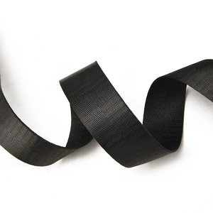 Detailed macro view of high-density black nylon webbing with durable plain weave texture