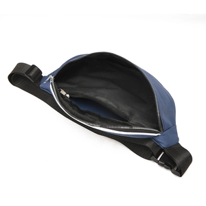 Detailed interior view of dark blue chest bag showing main compartment and zipper pocket