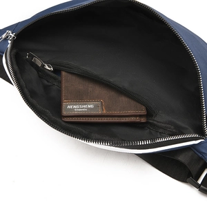 Detail view of the interior compartment with a zipper pocket and durable nylon lining