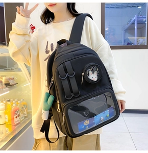 Detail view of black nylon ita bag with transparent windows and adjustable buckle straps