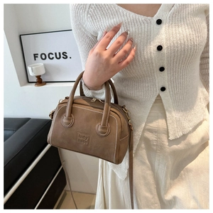 Brown retro PU leather handbag with white contrast stitching and gold metal hardware detail