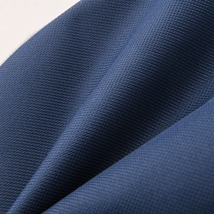 Close-up of durable navy blue oxford fabric showing detailed woven twill texture for the bag