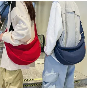 Adjustable crossbody half-moon bag in red and blue nylon for daily casual wear