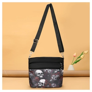 Sac bandoulière en tissu Oxford noir avec imprimé crâne floral et sangle réglable