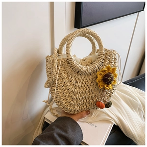 Spring 2024 woven straw crescent handbag with sunflower decor and drawstring lining