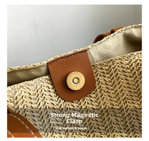 Macro shot of secure magnetic buckle closure on a straw tote with brown leather details