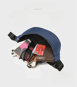 Macro view showing large capacity and organized interior compartments of the blue chest bag