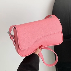 Pink minimalist PU leather crossbody bag with curved flap design and silver buckle