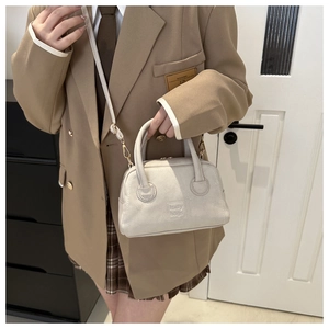 Chic cream white PU leather crossbody bag featuring an embossed lady bags logo detail