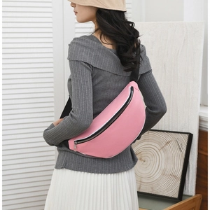 Pink waterproof canvas chest bag with black adjustable strap for casual fashion styles