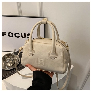 Fashionable beige faux leather handbag with gold hardware and lady bags logo for women