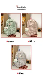 Detail of checkered tweed texture and cute plush charms on a pastel school backpack