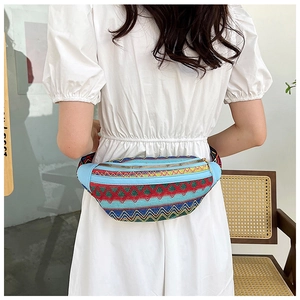 Detailed view of bohemian woven crossbody bag with colorful geometric wave patterns