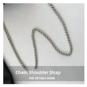 Macro shot of high-quality silver woven chain strap with premium black lychee leather