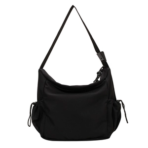 Minimalist black canvas crescent crossbody bag with large capacity and functional side pockets