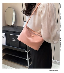 Pink minimalist leather shoulder bag detail with premium zipper and hardware finish