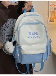 Detail of cream and sky blue backpack with panda pendant and durable double zippers