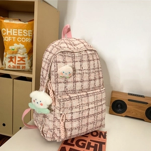 Pink and white tweed plaid backpack with cute peach patch and plush bear accessory
