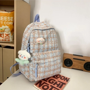 Stylish orange and blue checkered corduroy backpack with cute plush charm for women