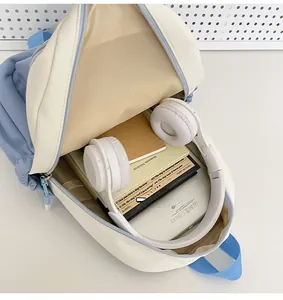 Interior view showing the storage capacity for headphones and notebooks in the backpack