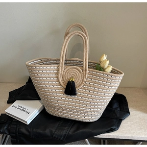 Fashionable rope woven tote bag with beige stripes and black tassel charms for women