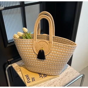 Fashion woven handbag with striped pattern, black polka dots and decorative tassels