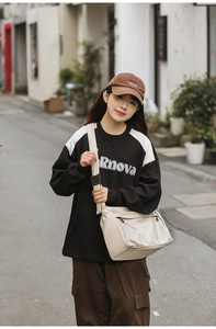 Fashionable oversized nylon crossbody bag in off-white for street style daily commuting