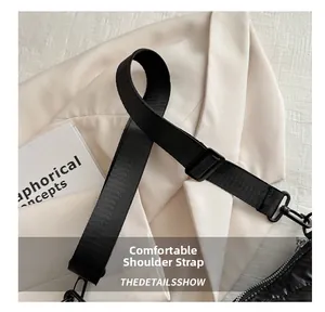 Detail showing high-density black nylon strap with adjustable metal buckle and lobster hook